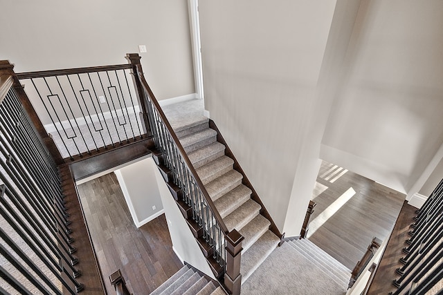 staircase featuring baseboards