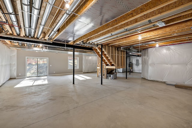 below grade area featuring stairs and electric panel