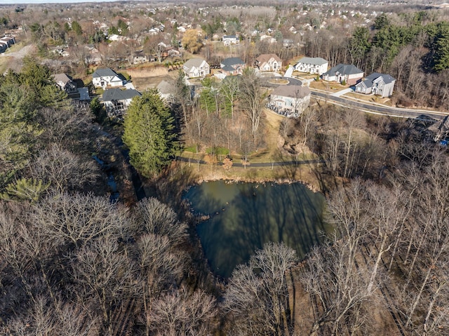 birds eye view of property with a water view and a residential view