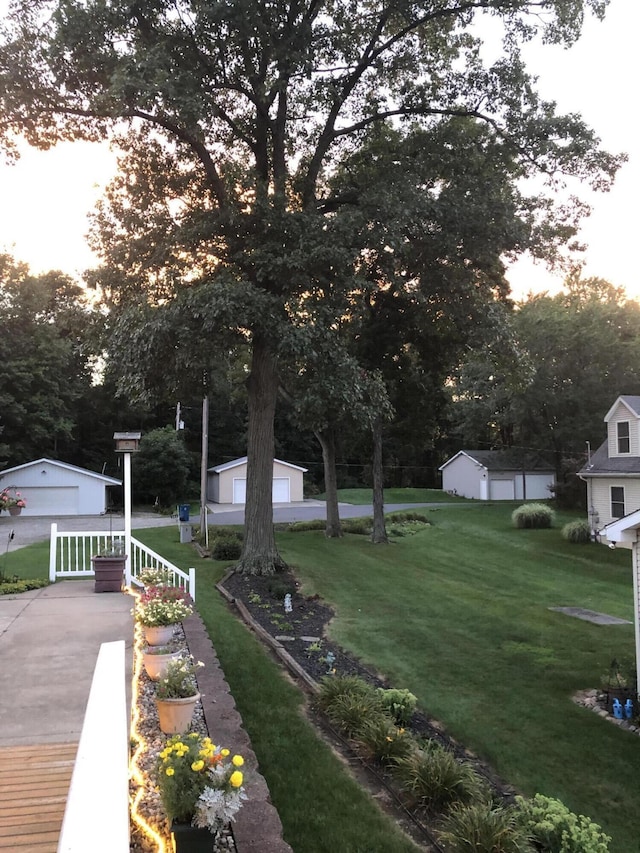 view of yard with an outbuilding and a detached garage