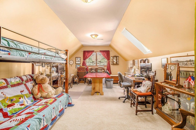 bedroom with lofted ceiling with skylight and carpet flooring