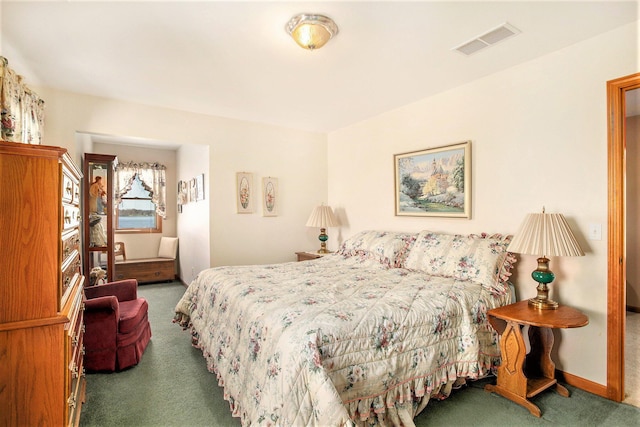 carpeted bedroom featuring baseboards and visible vents