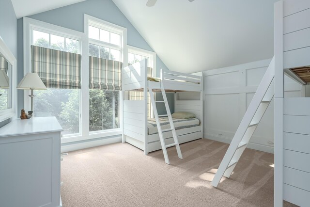 unfurnished bedroom with lofted ceiling and carpet flooring