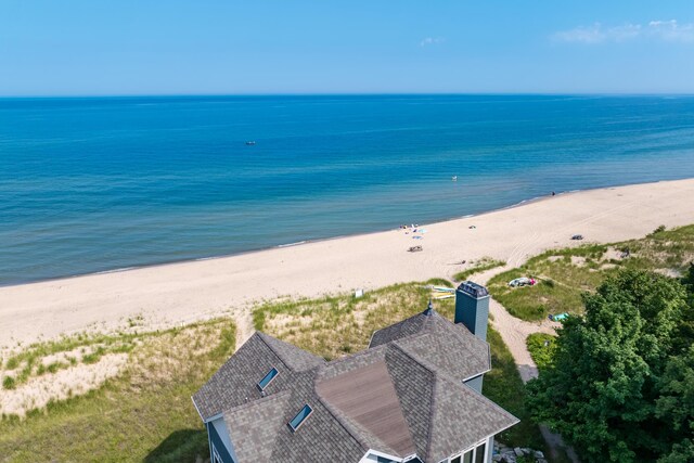bird's eye view featuring a beach view and a water view