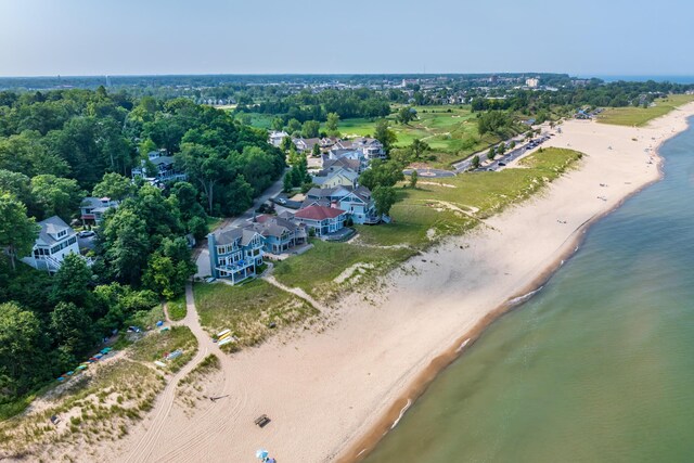 aerial view featuring a view of the beach and a water view