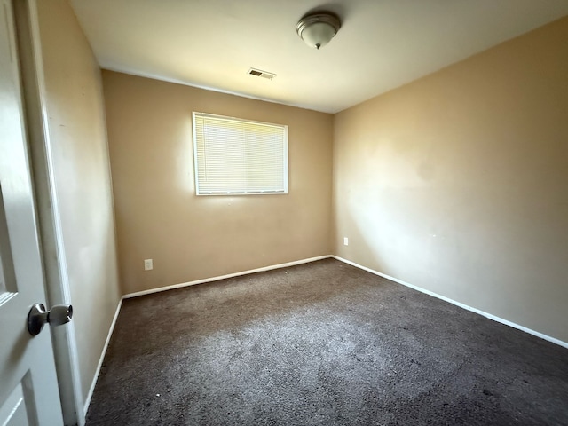 17684 Fenton St, Detroit, MI 48219 - spare room featuring baseboards, visible vents, and dark colored carpet