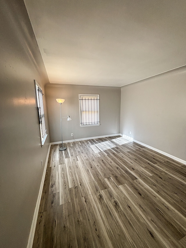 18484 Ashton Ave, Detroit, MI 48219 - empty room featuring baseboards and wood finished floors