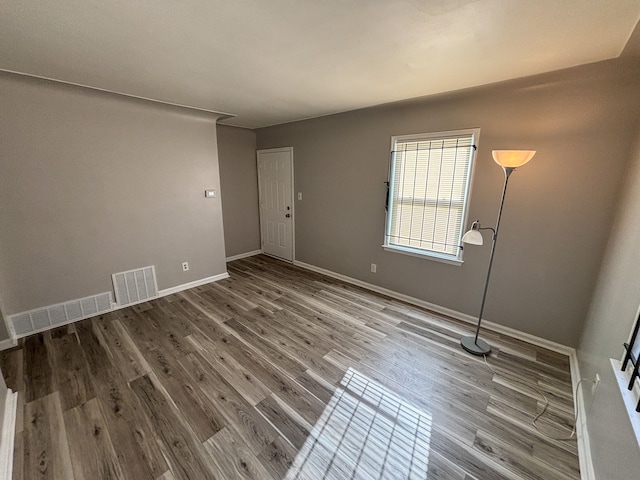 18484 Ashton Ave, Detroit, MI 48219 - unfurnished room with visible vents, baseboards, and wood finished floors