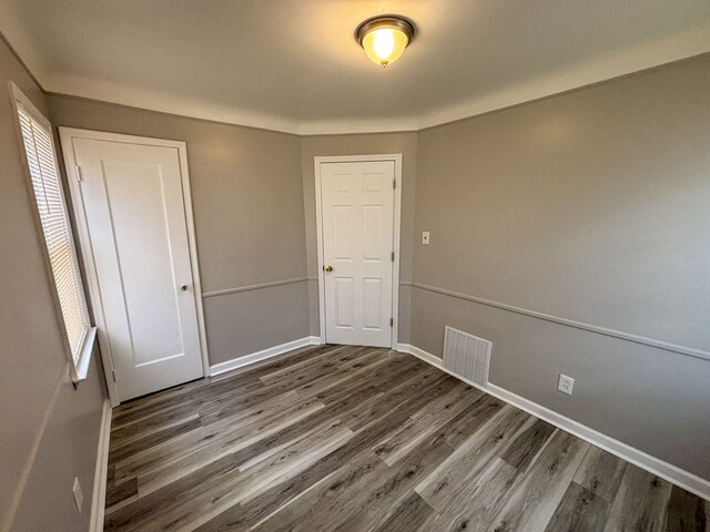 18484 Ashton Ave, Detroit, MI 48219 - spare room with visible vents, baseboards, and wood finished floors