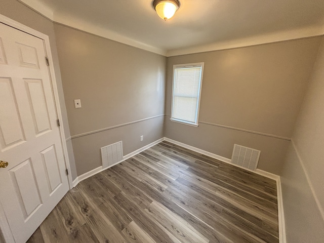 18484 Ashton Ave, Detroit, MI 48219 - empty room with visible vents, baseboards, and wood finished floors