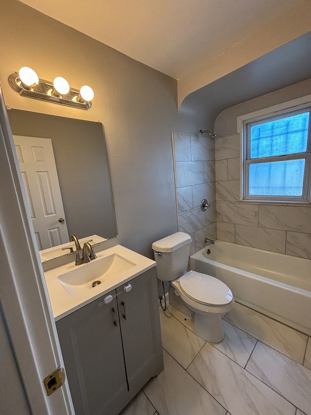 18484 Ashton Ave, Detroit, MI 48219 - bathroom with washtub / shower combination, toilet, marble finish floor, and vanity