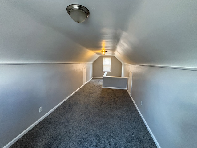 18484 Ashton Ave, Detroit, MI 48219 - additional living space featuring baseboards, lofted ceiling, and carpet
