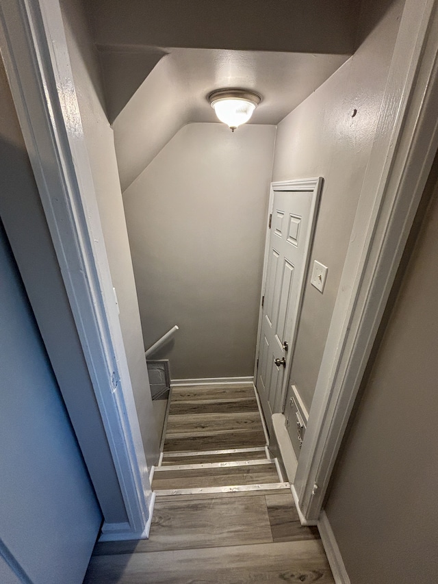 18484 Ashton Ave, Detroit, MI 48219 - stairway with wood finished floors, baseboards, and vaulted ceiling