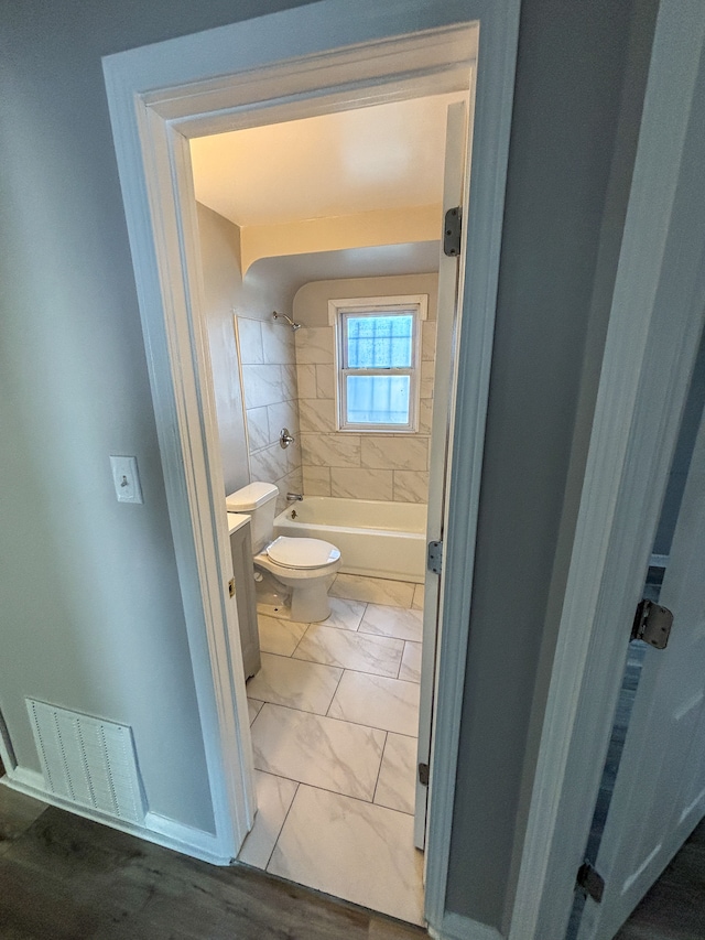 18484 Ashton Ave, Detroit, MI 48219 - bathroom with toilet, marble finish floor, bathtub / shower combination, and visible vents