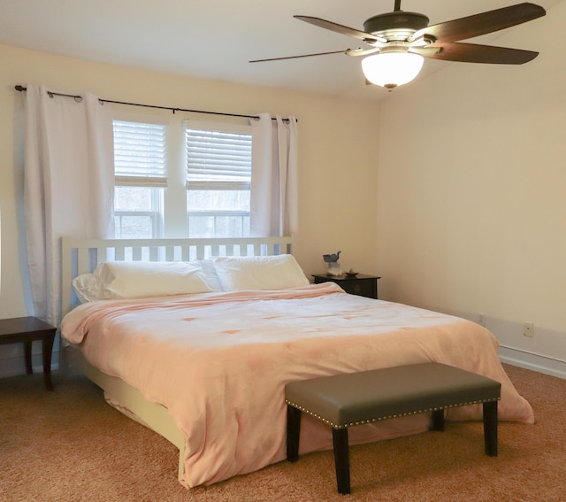 bedroom featuring a ceiling fan and light carpet