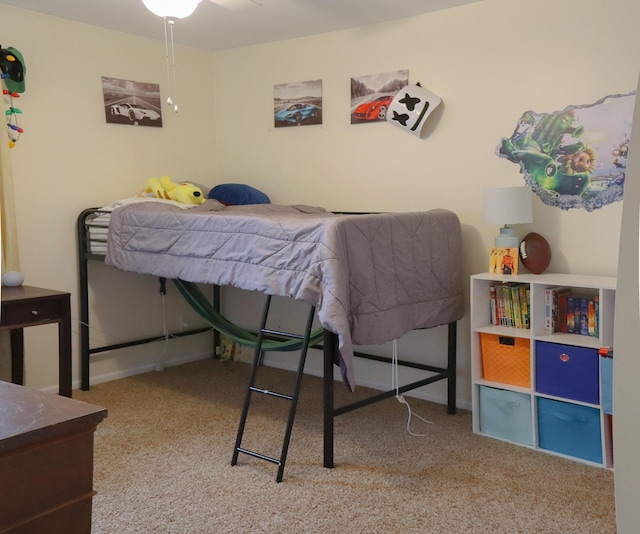 bedroom with baseboards and carpet floors