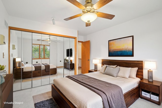 bedroom featuring a closet, a ceiling fan, and visible vents