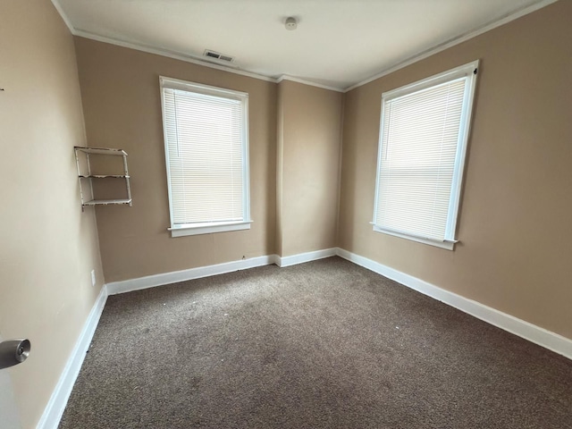 3297 Hazelwood St, Detroit, MI 48206 - empty room featuring baseboards, crown molding, dark colored carpet, and visible vents