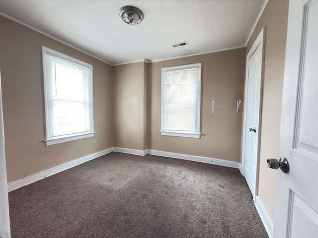 3297 Hazelwood St, Detroit, MI 48206 - spare room featuring visible vents, baseboards, ornamental molding, and carpet floors