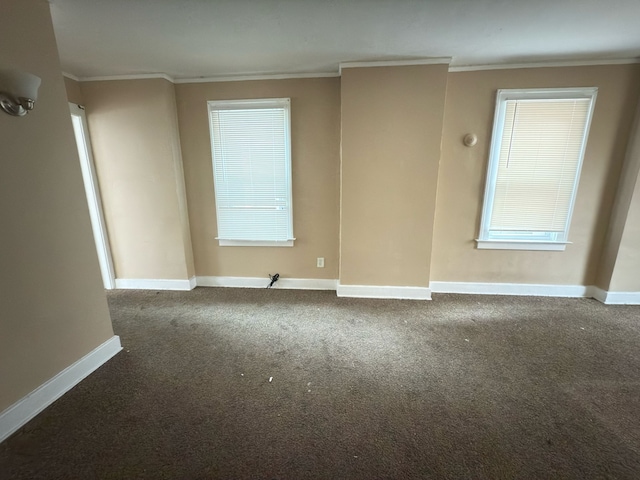 3297 Hazelwood St, Detroit, MI 48206 - spare room featuring crown molding, baseboards, and carpet