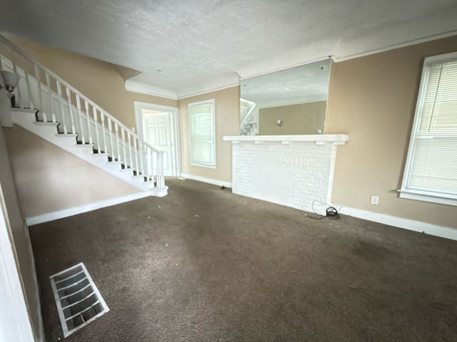 3297 Hazelwood St, Detroit, MI 48206 - unfurnished living room featuring carpet flooring, stairway, visible vents, and baseboards