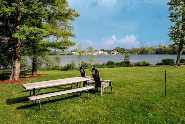 750 Centre Pl, Traverse City, MI 49686 - view of home's community with a water view and a yard