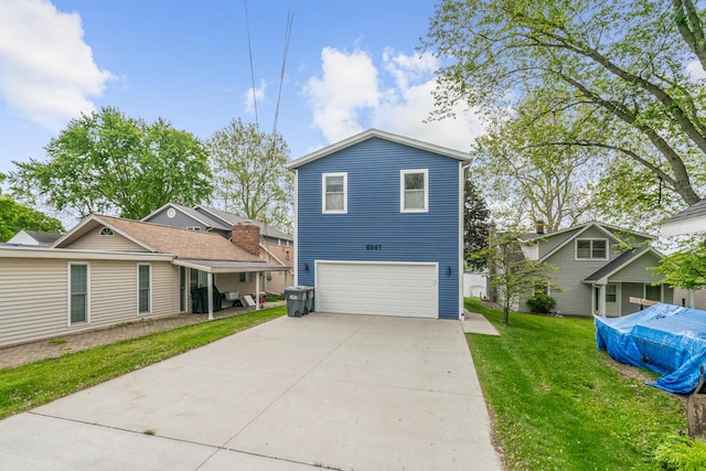 8841 Waruf Ave, Portage, MI 49002 - view of front of property featuring a garage, concrete driveway, and a front yard