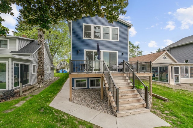8841 Waruf Ave, Portage, MI 49002 - back of house with a wooden deck, stairs, and a lawn