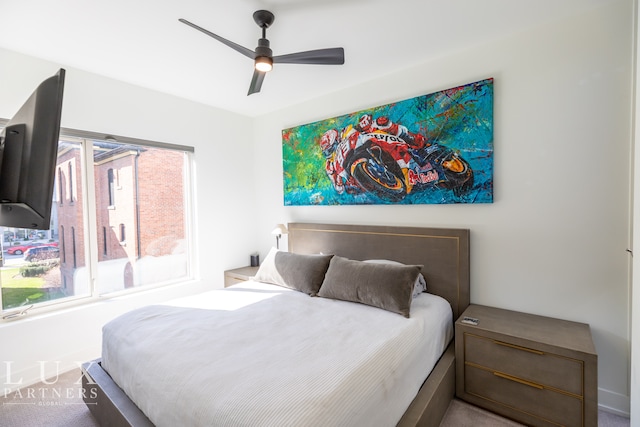 carpeted bedroom with ceiling fan