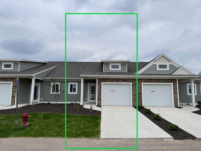 1211 Madera Ct SW, Byron Center, MI 49315 - multi unit property with a shingled roof, driveway, a front lawn, and board and batten siding
