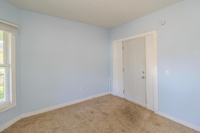 637 Prospect Ave NE, Grand Rapids, MI 49503 - carpeted spare room with baseboards and a smoke detector