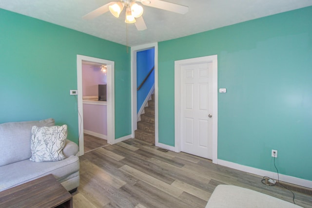 637 Prospect Ave NE, Grand Rapids, MI 49503 - living area with ceiling fan, wood finished floors, and baseboards