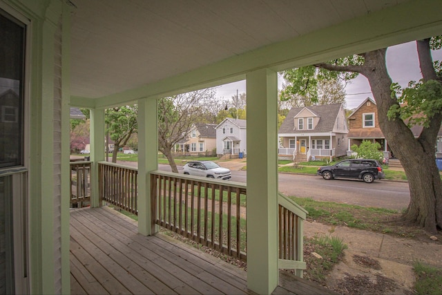 637 Prospect Ave NE, Grand Rapids, MI 49503 - wooden terrace featuring a porch and a residential view