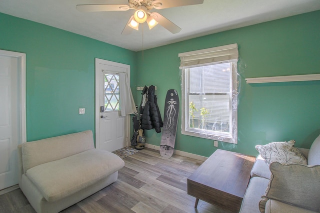 637 Prospect Ave NE, Grand Rapids, MI 49503 - living area with wood finished floors, a ceiling fan, and baseboards