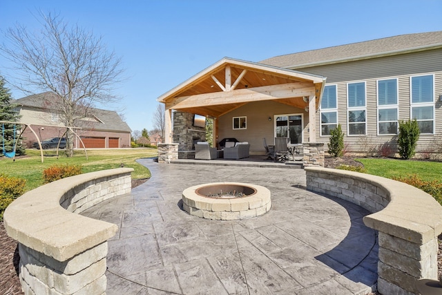 7416 Secretariat Dr, Saline, MI 48176 - view of patio with an outdoor living space with a fire pit