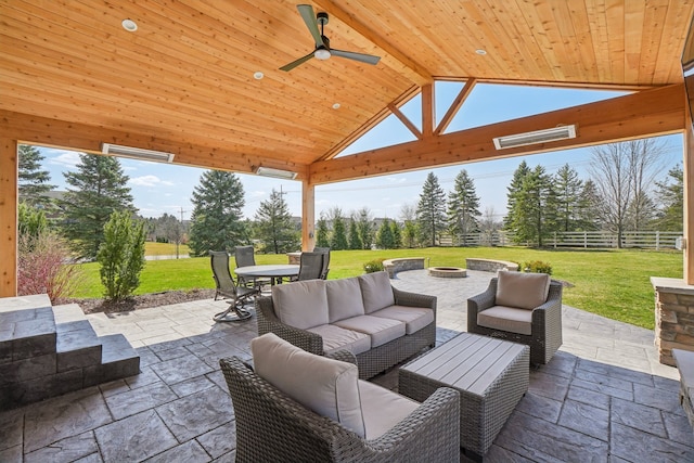 7416 Secretariat Dr, Saline, MI 48176 - view of patio with an outdoor living space with a fire pit, visible vents, fence, a gazebo, and outdoor dining space