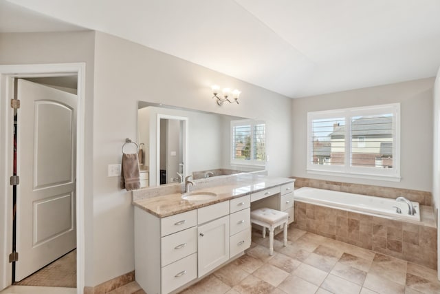 7416 Secretariat Dr, Saline, MI 48176 - bathroom featuring vanity and a relaxing tiled tub