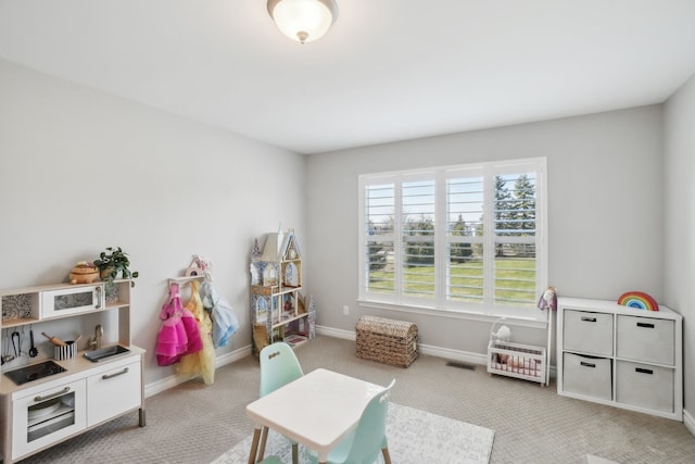 7416 Secretariat Dr, Saline, MI 48176 - game room with light carpet, baseboards, and visible vents