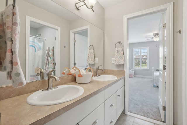 7416 Secretariat Dr, Saline, MI 48176 - full bathroom with double vanity, a sink, a ceiling fan, and baseboards
