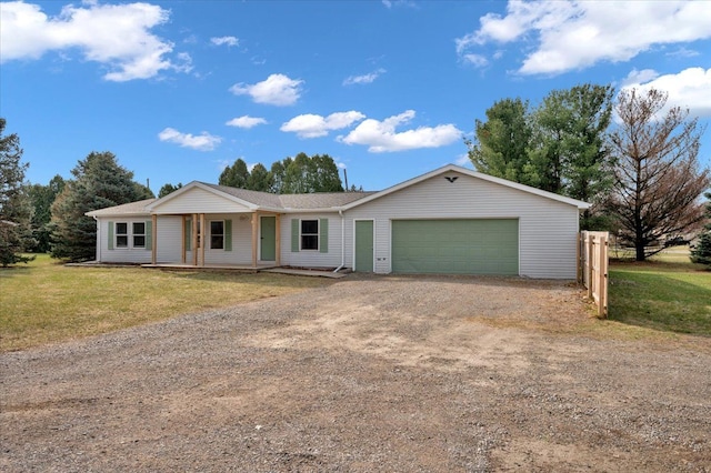 ranch-style home featuring driveway, covered porch, fence, a front lawn, and a garage