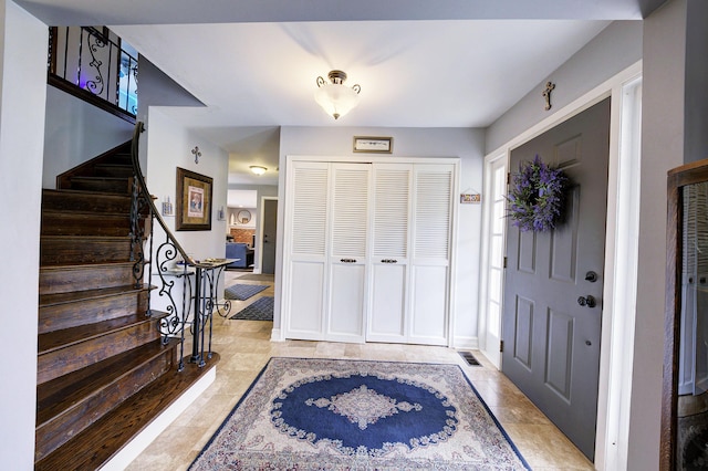 foyer featuring stairway