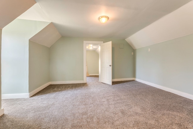 bonus room with carpet, lofted ceiling, and baseboards