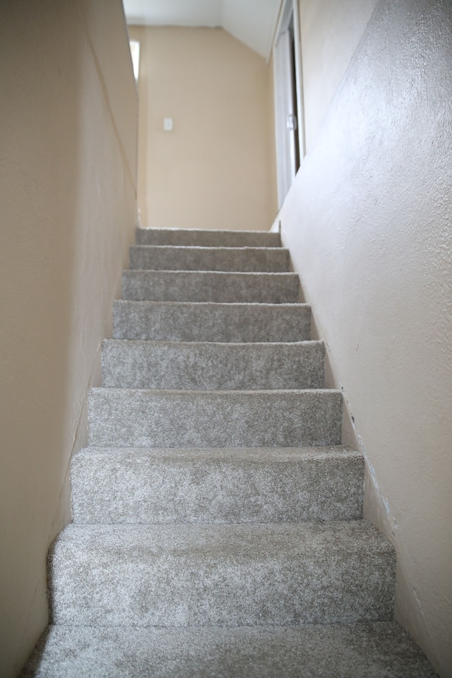 8848 Heyden St, Detroit, MI 48228 - stairway featuring lofted ceiling