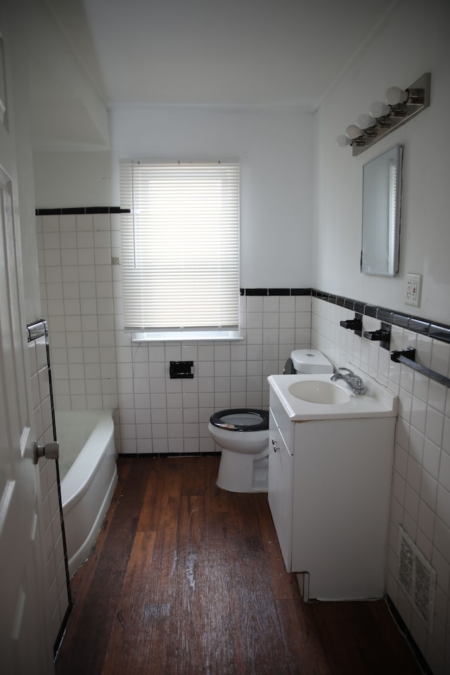 8848 Heyden St, Detroit, MI 48228 - full bath featuring vanity, toilet, visible vents, wainscoting, and hardwood / wood-style floors