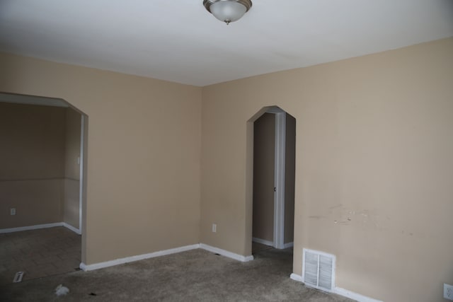 8848 Heyden St, Detroit, MI 48228 - unfurnished bedroom with visible vents, baseboards, arched walkways, and carpet floors