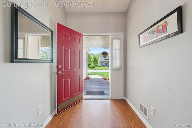 328 Split Rail Rdg, Williamston, MI 48895 - entrance foyer with wood finished floors and baseboards