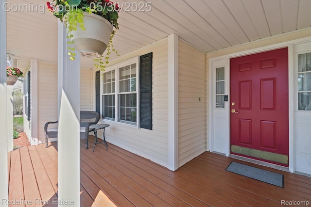 328 Split Rail Rdg, Williamston, MI 48895 - doorway to property featuring a porch
