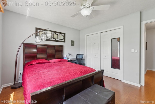 328 Split Rail Rdg, Williamston, MI 48895 - bedroom featuring wood finished floors, a closet, baseboards, and ceiling fan
