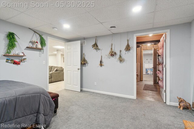 328 Split Rail Rdg, Williamston, MI 48895 - bedroom featuring carpet, baseboards, and a drop ceiling
