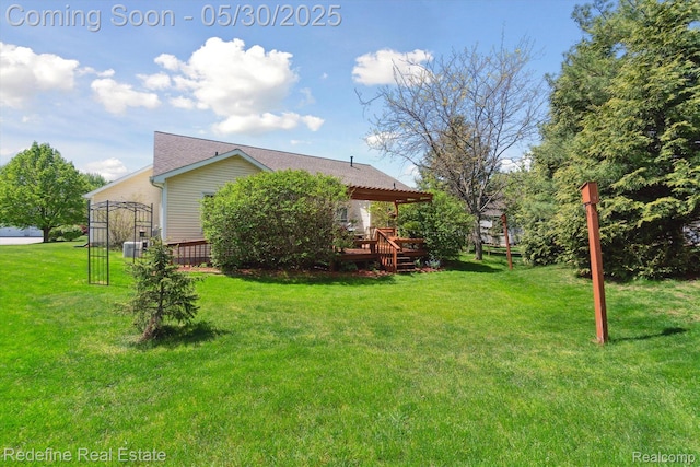 328 Split Rail Rdg, Williamston, MI 48895 - view of grassy yard with a wooden deck